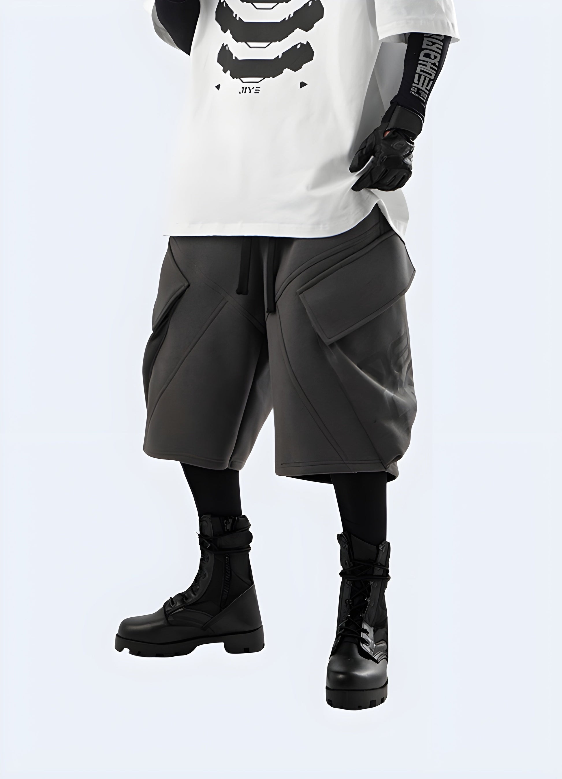 Man wearing grey cyberpunk shorts, showcasing the striking color and avant-garde style, ideal for standing out in the UK alternative fashion scene.