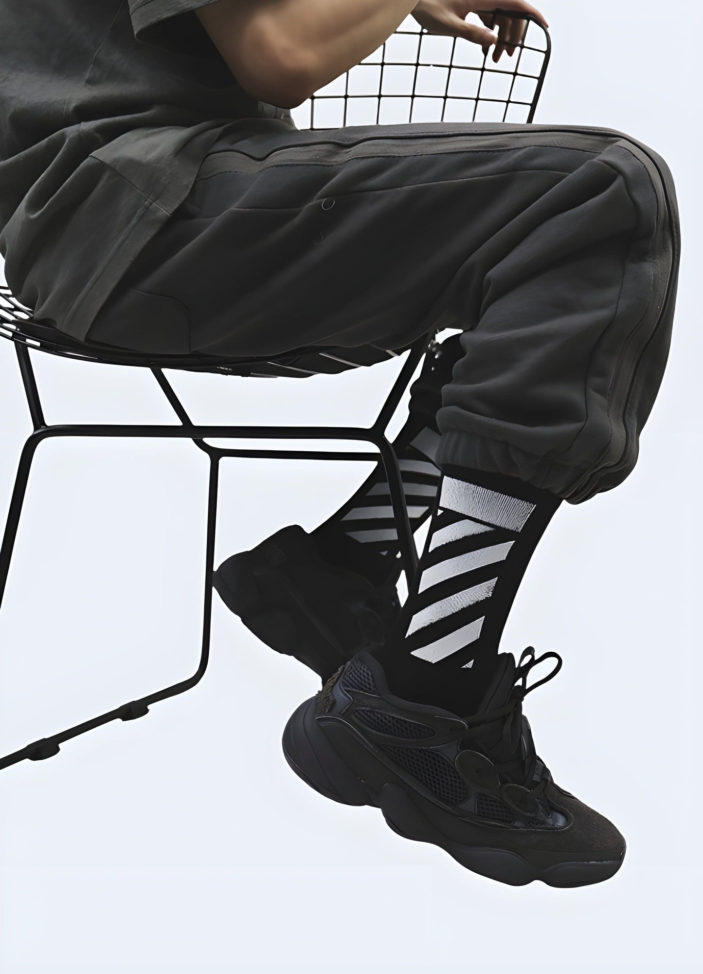 Front view of a man wearing cyberpunk socks, showcasing the bold and futuristic style that's trending in the UK streetwear scene.