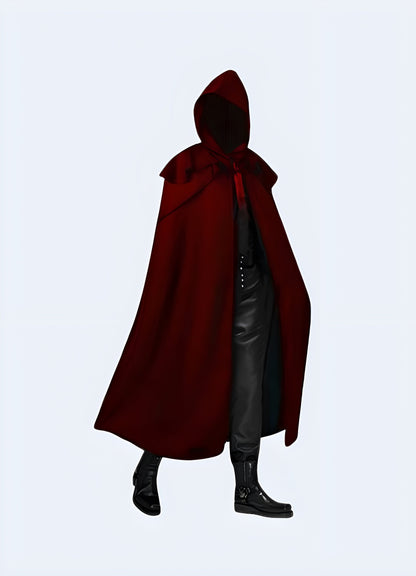 Front view of a man sporting a red dark futuristic hooded cloak, highlighting its eye-catching hue and innovative design, ideal for those who appreciate unconventional and futuristic fashion in the UK.