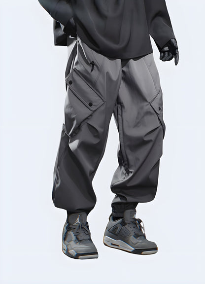 Front view of a man modeling dark grey cargo pants, showcasing the style and fit from the front perspective.