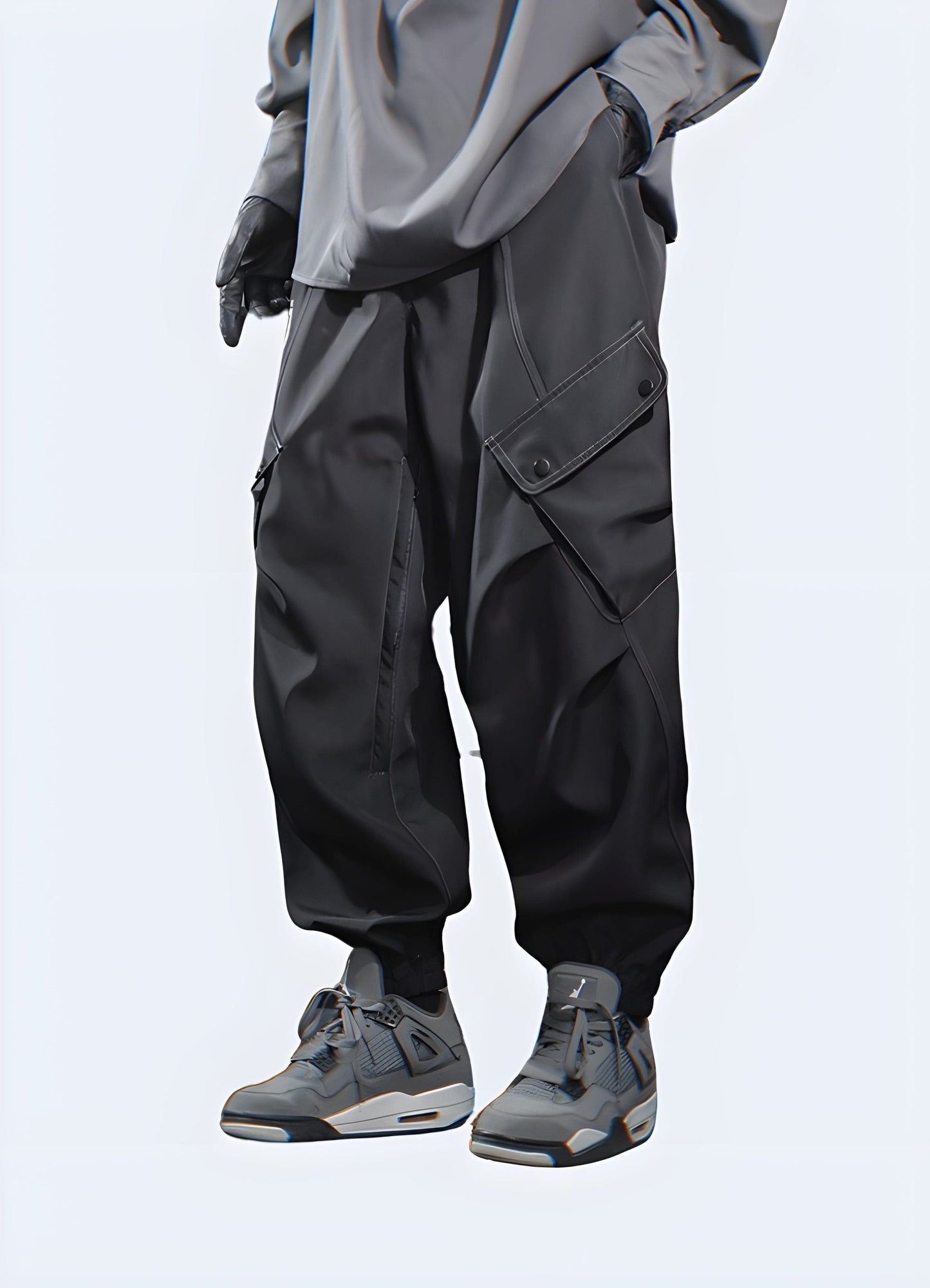 Side view of a man wearing dark grey cargo pants, highlighting the design features and silhouette from the side angle.