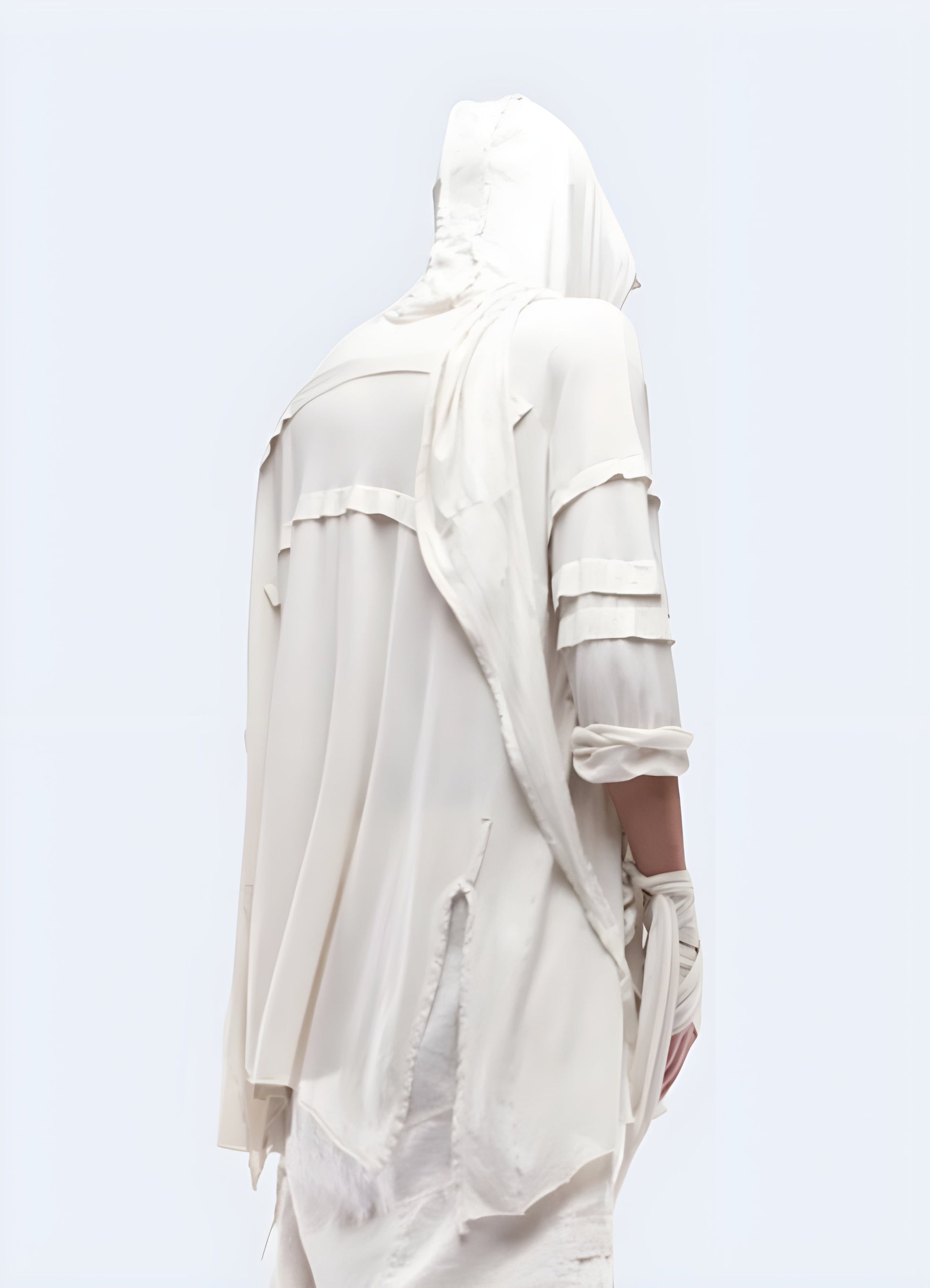 Back view of a man donning a dystopian techwear cloak, emphasizing its high-quality construction and attention to detail for a cutting-edge and rebellious style in the UK.