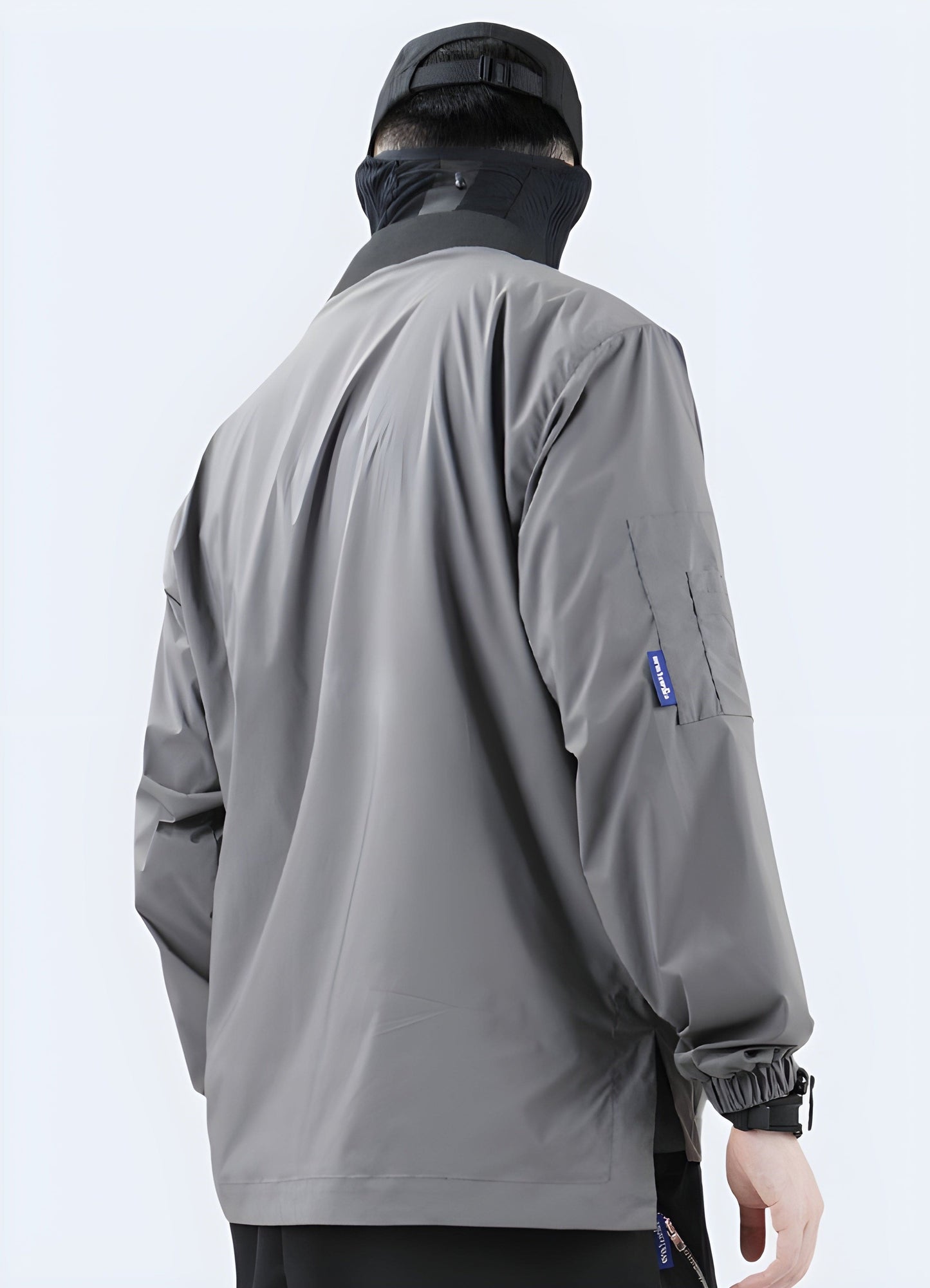 Back side view of a man sporting a pioneering futuristic noragi, highlighting the garment's unconventional silhouette, meticulous craftsmanship, and the seamless integration of tradition with cutting-edge technology for a truly one-of-a-kind look.