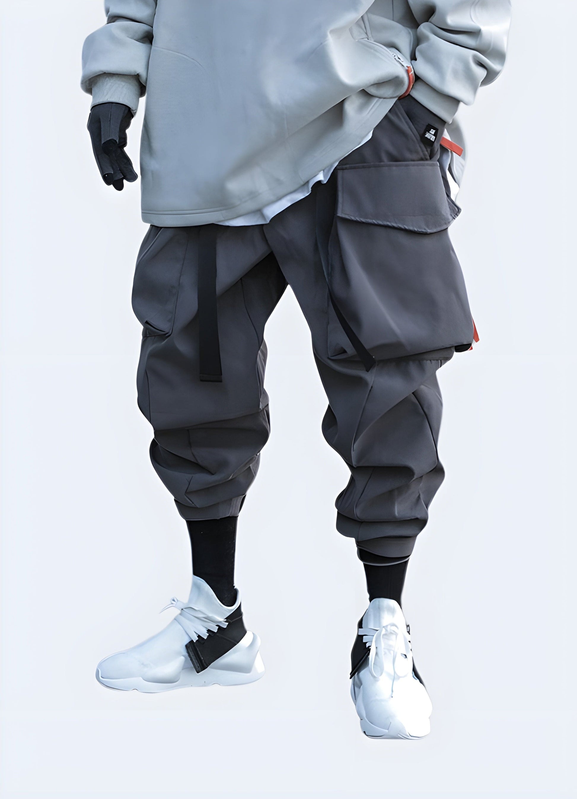 Front view of a man wearing gray tactical pants, featuring a comfortable fit and modern style, suitable for various occasions in the UK.