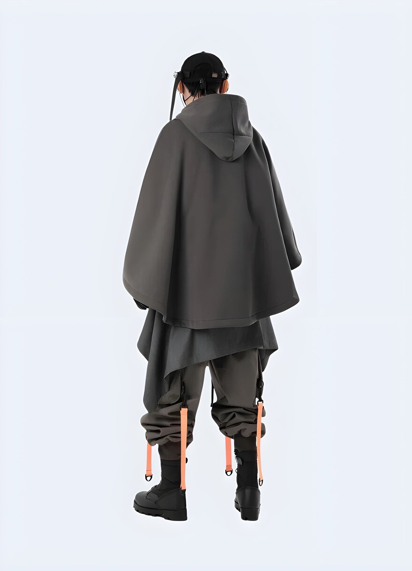 Back view of a model wearing a grey cloak hoodie, highlighting its unique silhouette and contemporary design for a fashionable and eye-catching look in the UK.