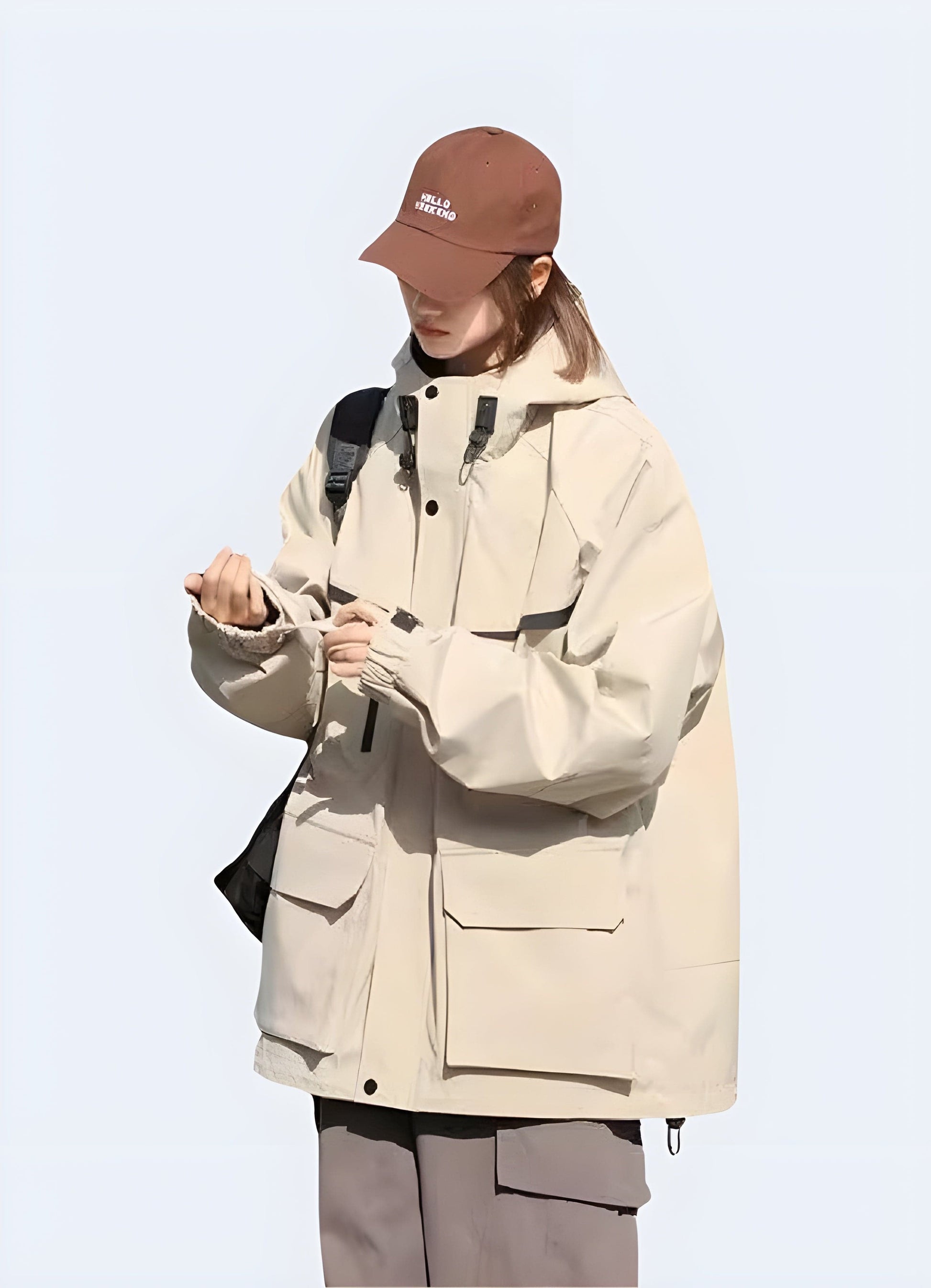 Side view of a man wearing a beige hooded cargo jacket, emphasizing its roomy fit, multiple pockets, and versatile design, perfect for UK consumers seeking a comfortable and practical outerwear option for everyday wear.