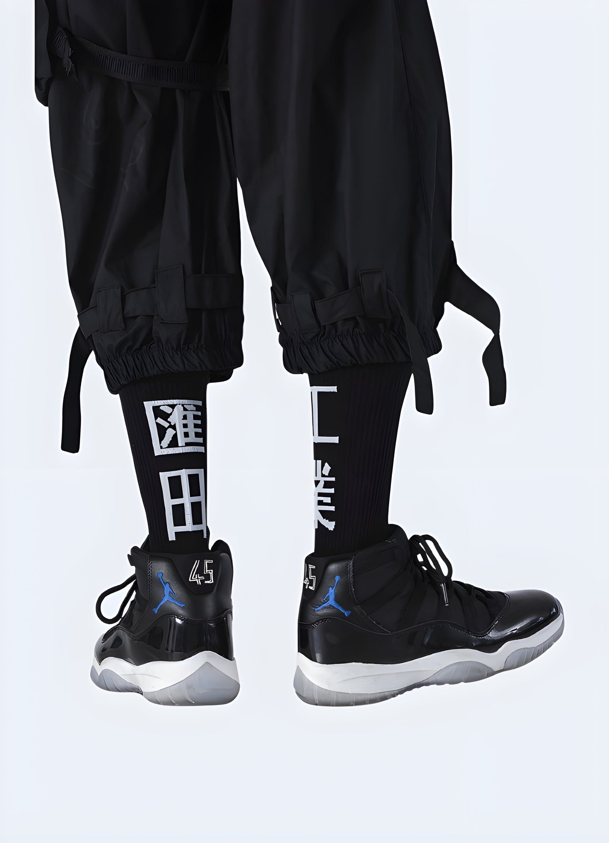 Back view of a man wearing black kanji socks, highlighting the eye-catching design and comfortable fit for UK streetwear enthusiasts.