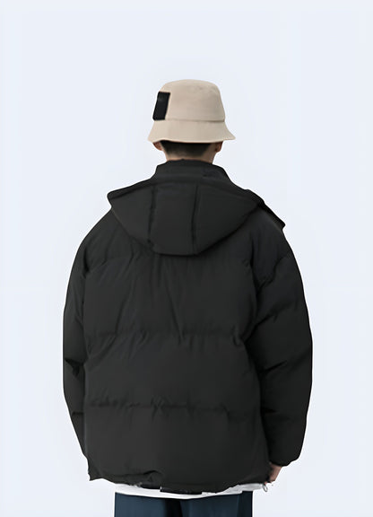 Back view of a man wearing a sleek black Korean techwear jacket, perfect for the UK's urban fashion scene.