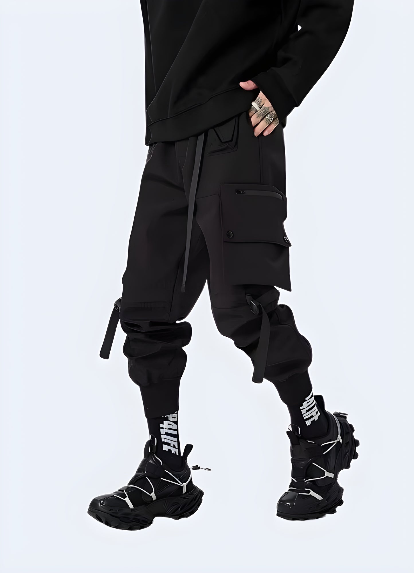 Model wearing urban cargo pants, side view, stylish streetwear fashion in the UK.