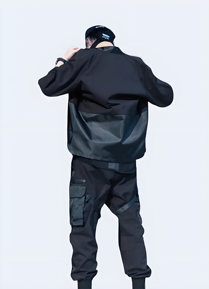 Back view of a man wearing noragi techwear, showcasing the unique silhouette and functional design elements, ideal for the UK fashion-forward individual seeking a cutting-edge look.