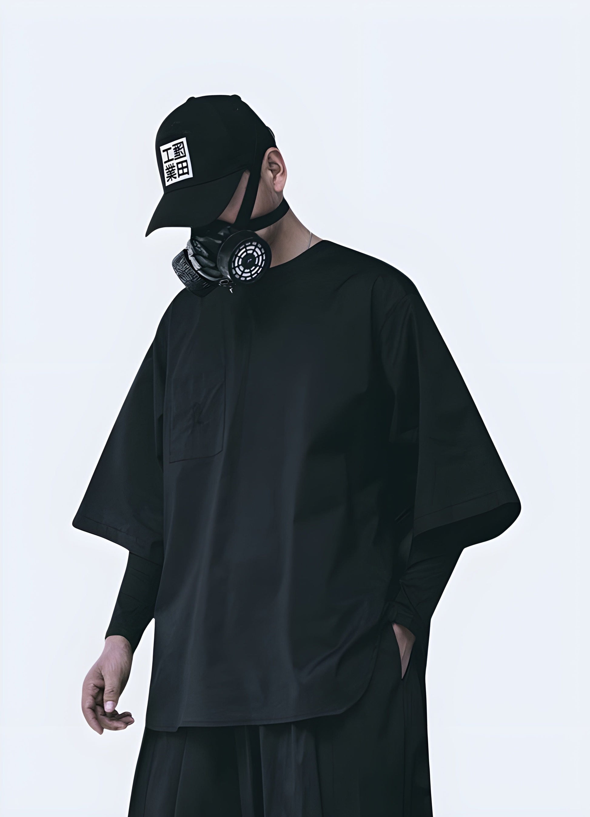 Front side view of a man wearing an oversized techwear shirt, showcasing its trendy silhouette and versatile style for everyday wear in the UK.