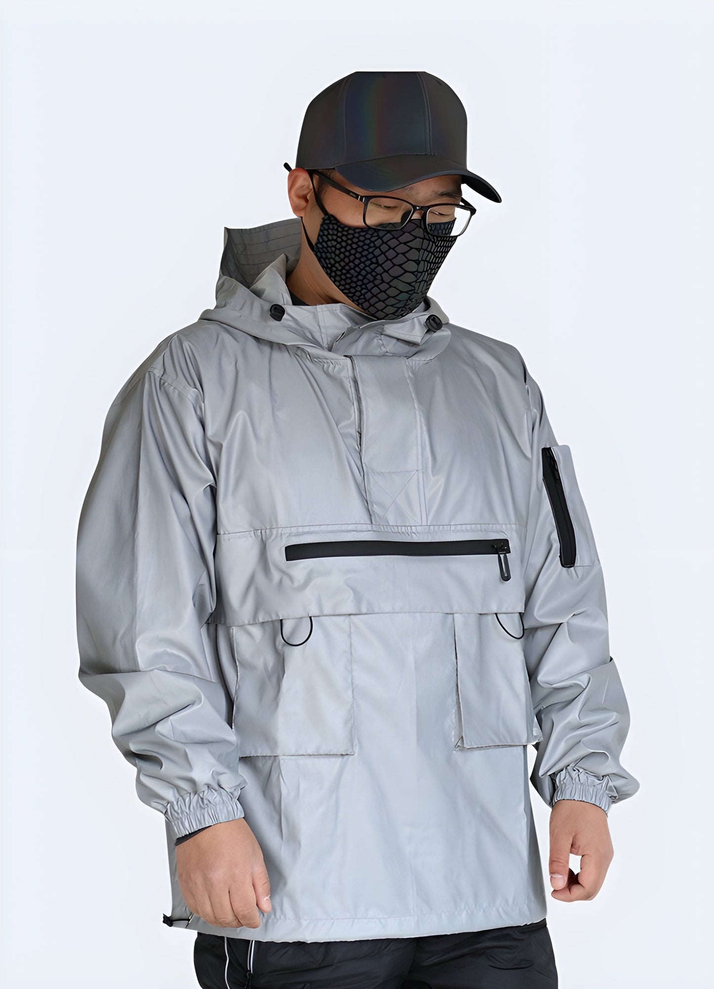 Front view of a man wearing a reflective jacket, showcasing its practical safety features, urban-inspired design, and trendy appeal, ideal for UK consumers seeking a functional and stylish outerwear option.