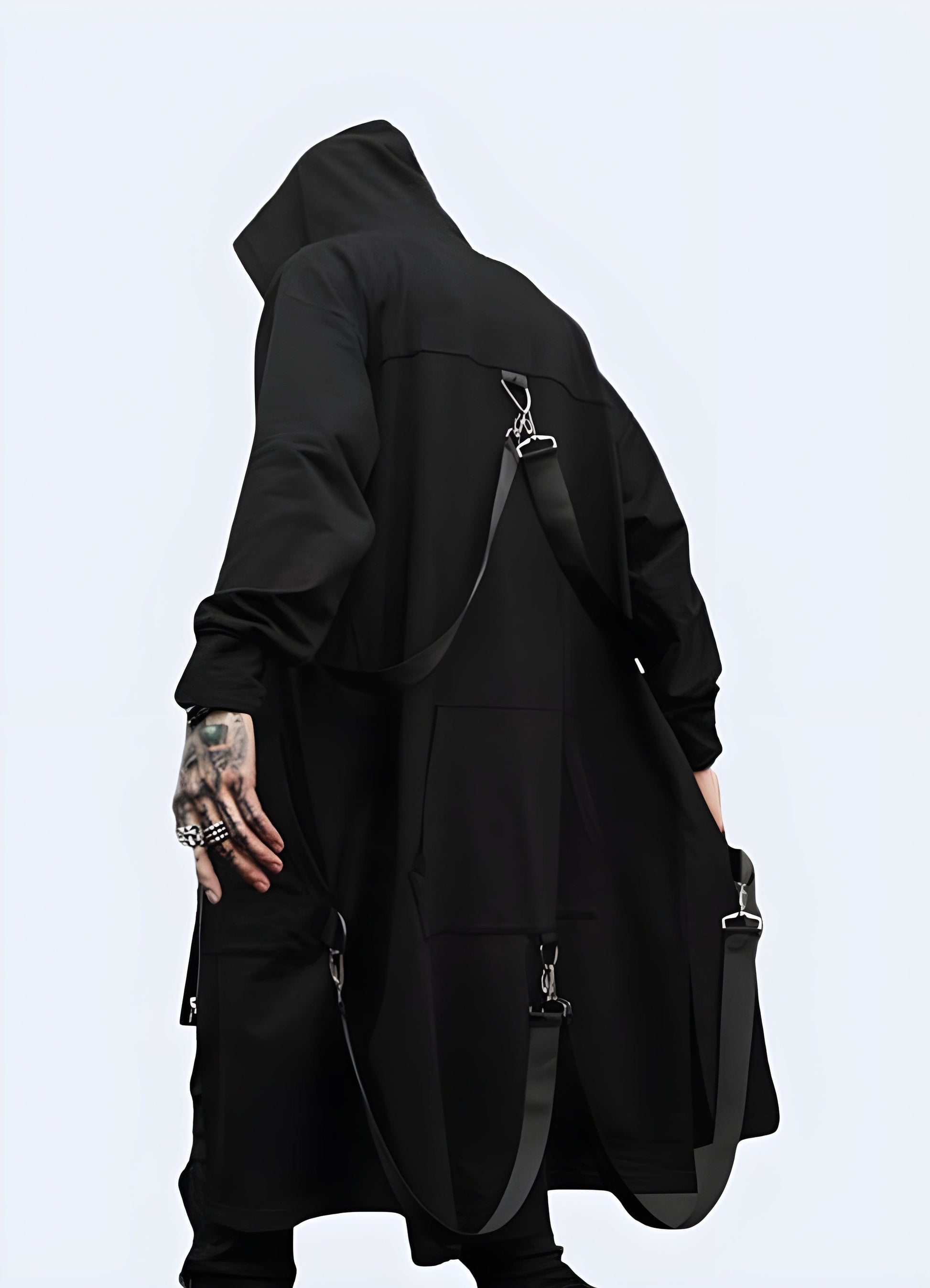 Back view of a man wearing a sci-fi techwear cloak, showcasing its unique silhouette and advanced materials for a striking and functional look in the UK.