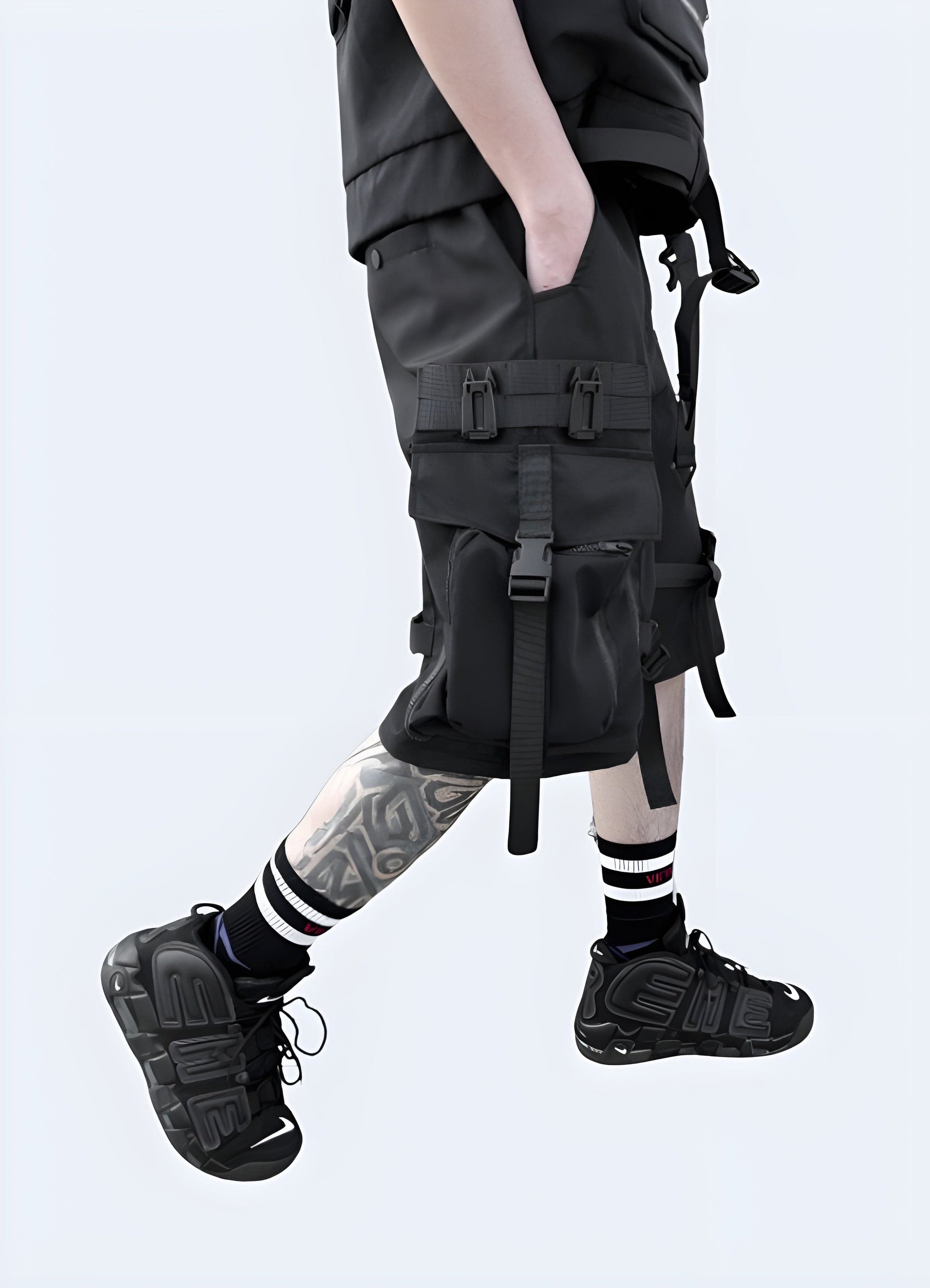 Side view of a man wearing streetwear cargo shorts, featuring a modern fit and versatile style, suitable for everyday wear in the UK urban environment.