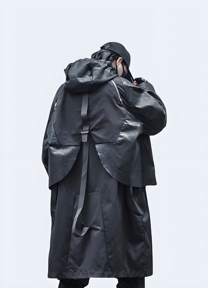 Back view of a man wearing a streetwear trench coat, emphasizing its sleek silhouette, practical features, and modern aesthetics, perfect for fashion-savvy UK consumers navigating the city streets.