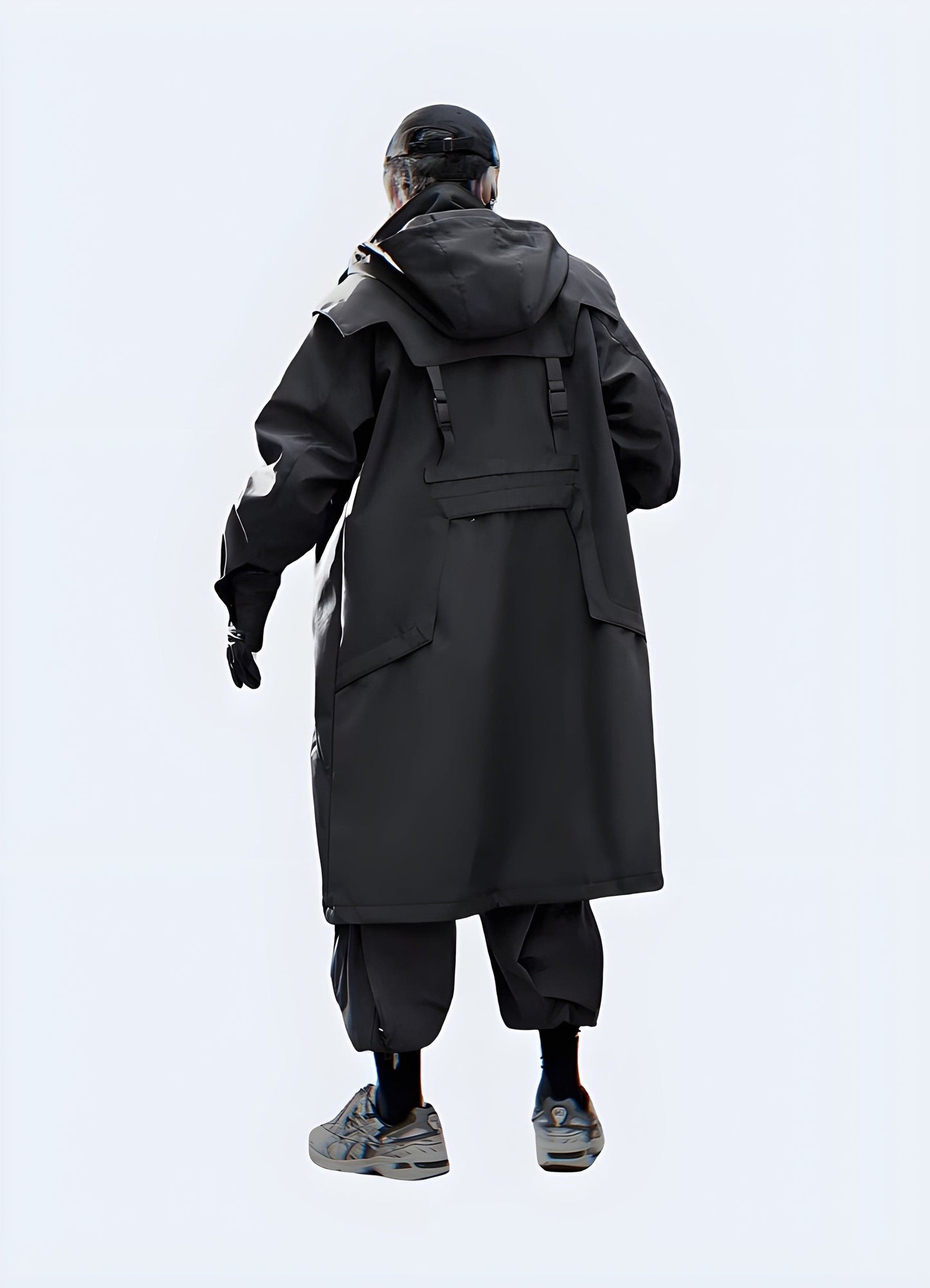 Back view of a man wearing a streetwear trench coat, emphasizing its sleek silhouette, practical features, and modern aesthetics, perfect for fashion-savvy UK consumers navigating the city streets.