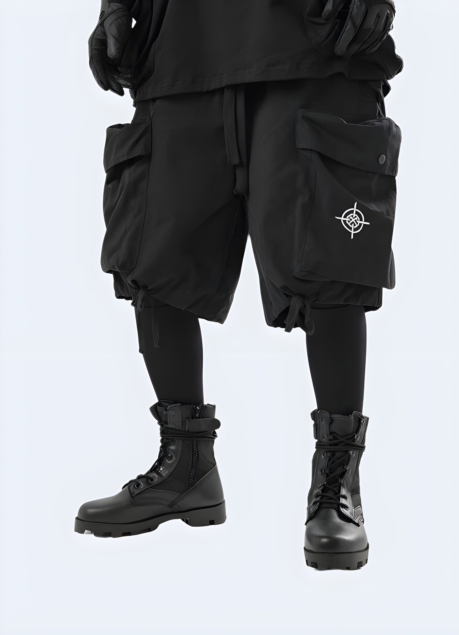 Front side view of a man wearing black tactical cargo shorts, showcasing the rugged design and practical features suitable for the UK outdoor enthusiast.