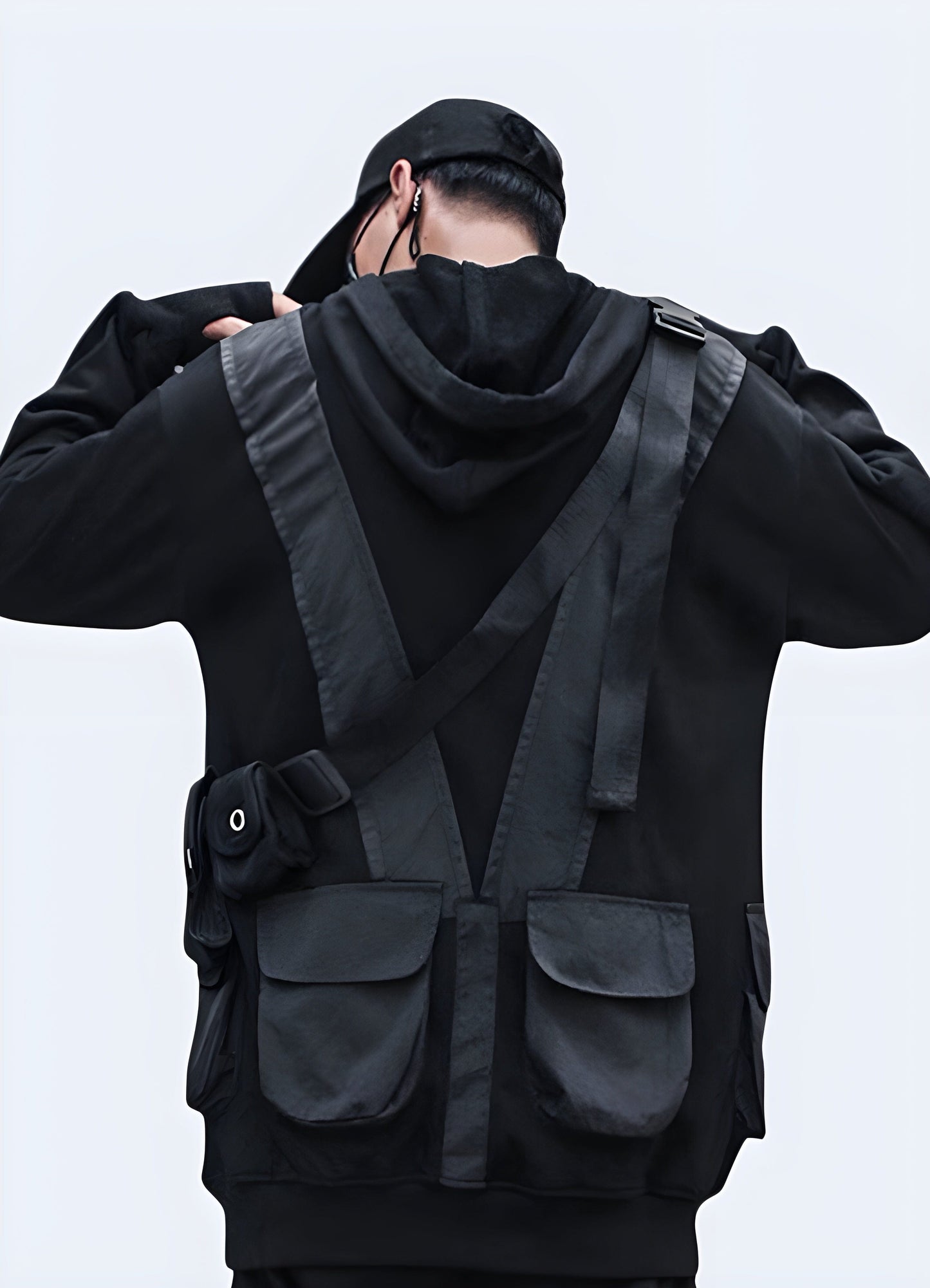 Man wearing a tactical sweatshirt, back view, highlighting the garment's comfortable fit and practical features, ideal for UK weather conditions.