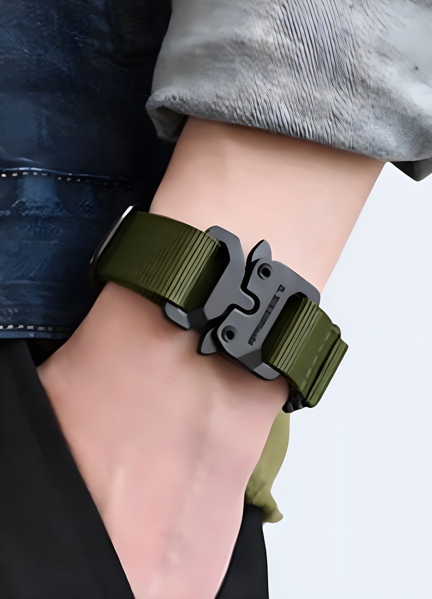 Man wearing a techwear buckle bracelet in green, UK, demonstrating the bracelet's unique and stylish appearance from the front view.