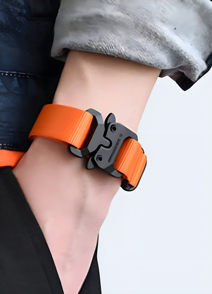 Man wearing a techwear buckle bracelet in orange, UK, illustrating its vibrant and eye-catching design from the front view.