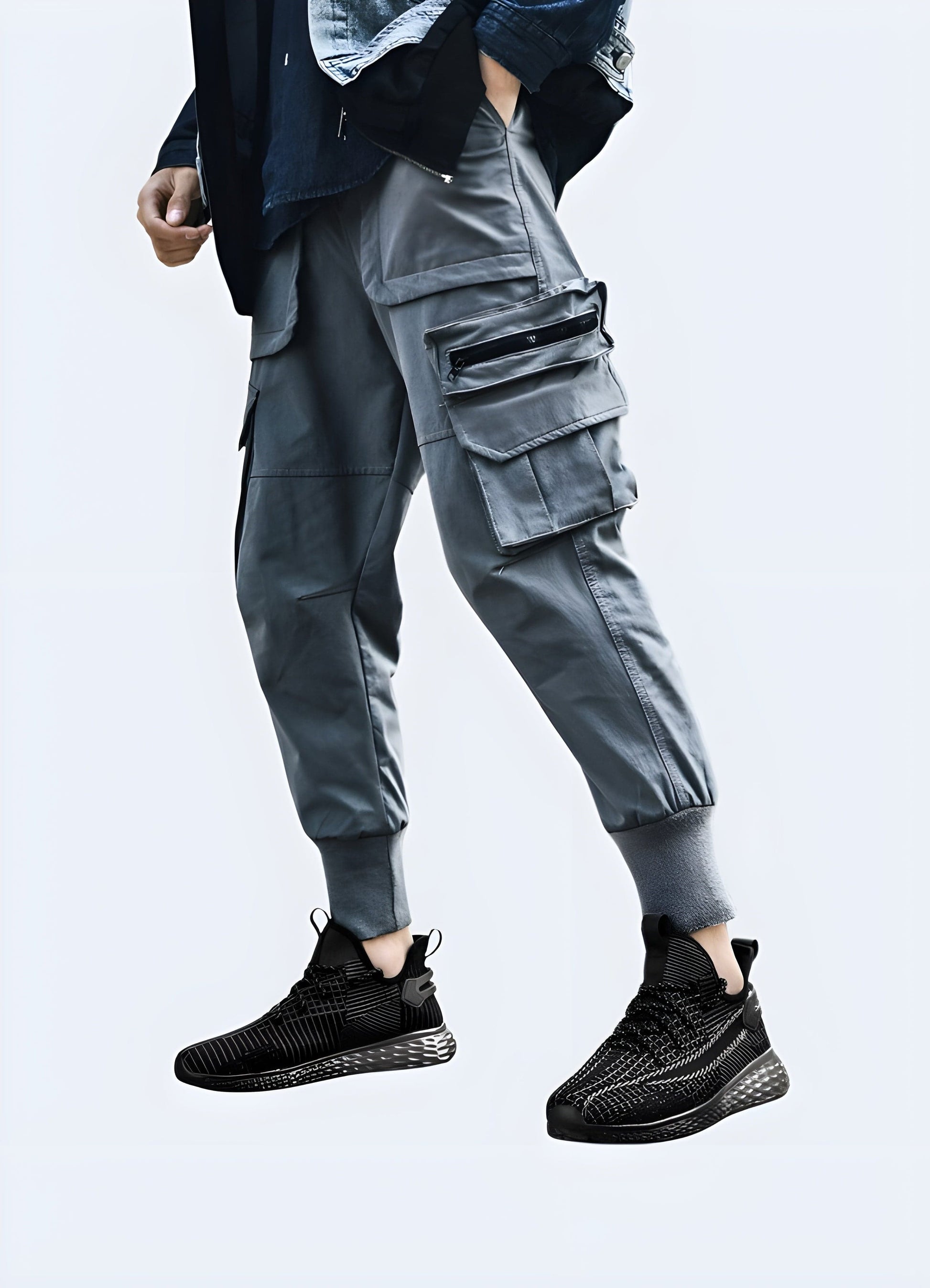 Man sporting techwear running shoes, front side view, displaying the shoe's unique features. UK-based model shoot.