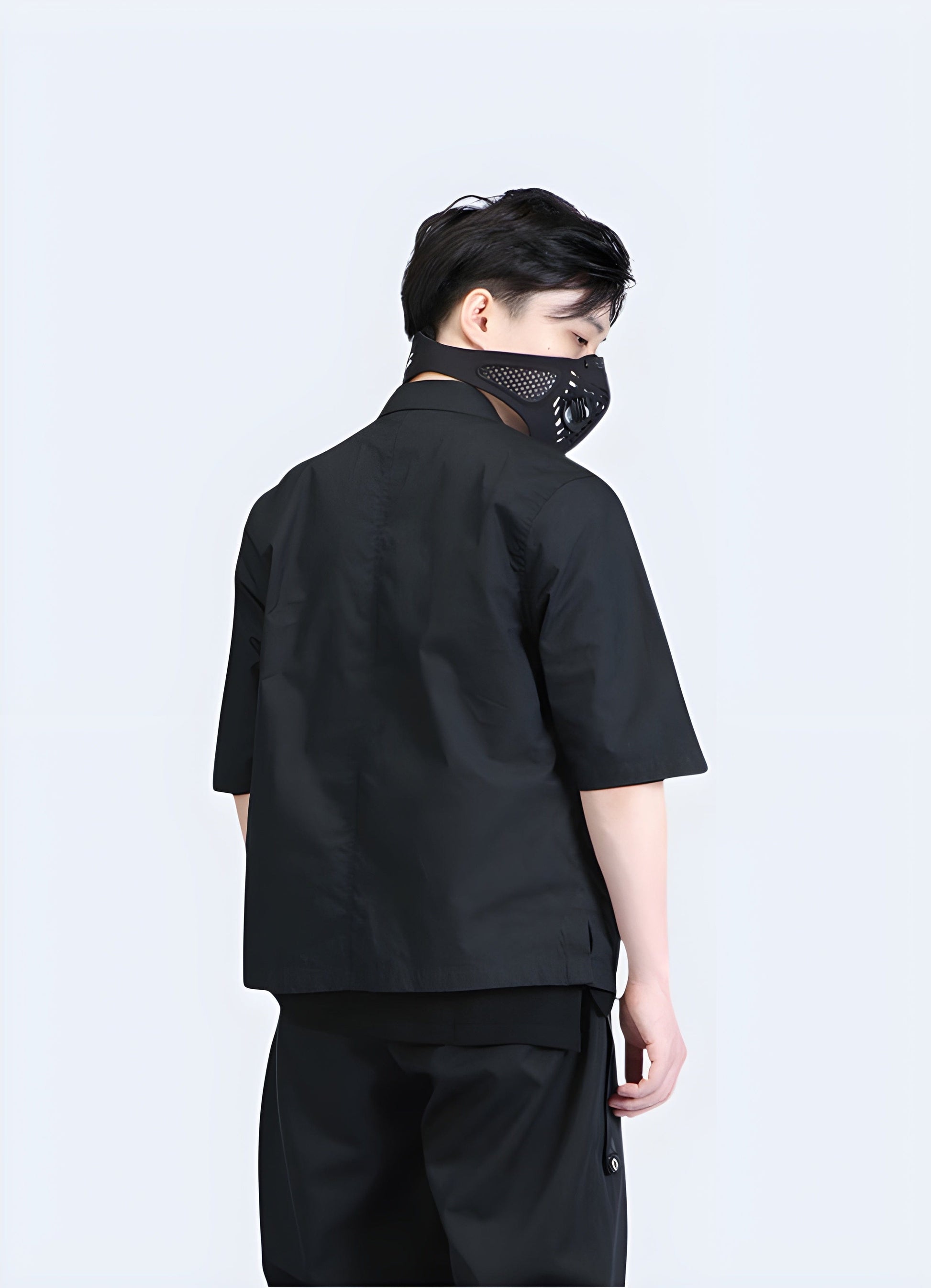 Back view of a man wearing a groundbreaking traditional techwear haori, showcasing the garment's sleek lines, advanced technical materials, and contemporary design that seamlessly blends tradition with innovation.