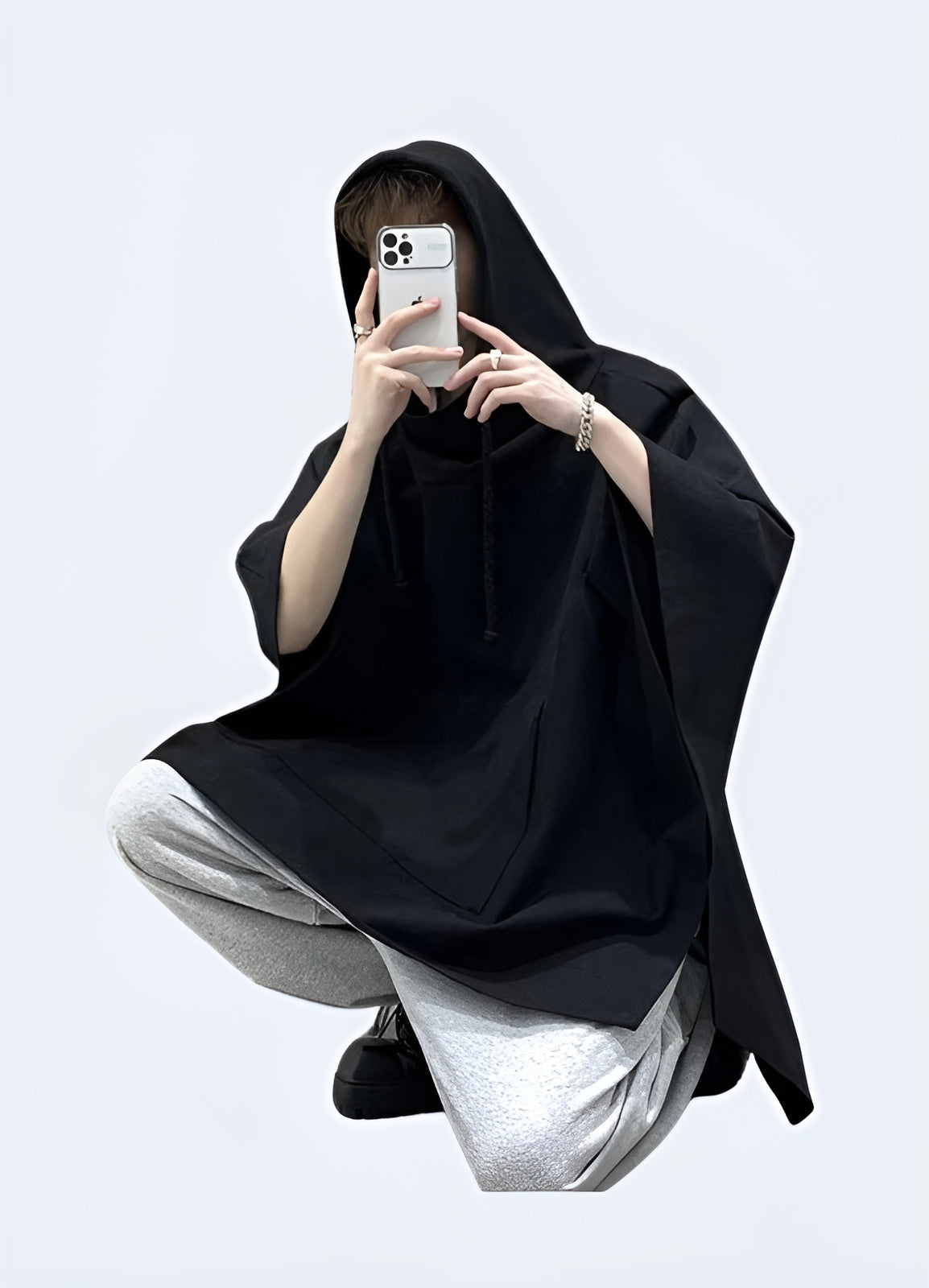 Front view of a cutting-edge multi-pocket techwear poncho, showcasing the garment's advanced technical features, versatile storage options, and sleek, contemporary design that redefines outerwear for the modern era.