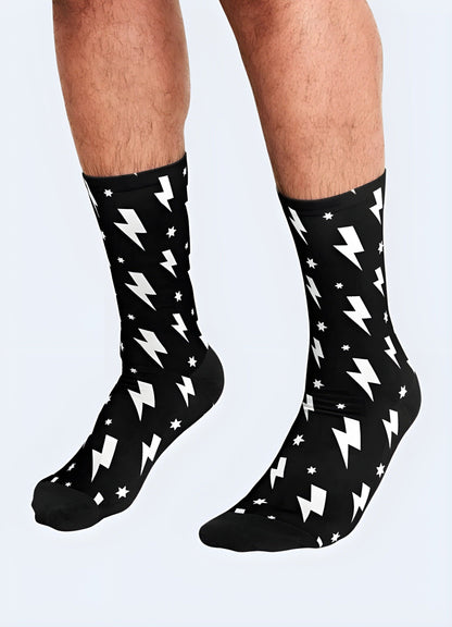 Man sporting trendy socks with a striking lightning bolt pattern, showcasing the front view of these eye-catching accessories.