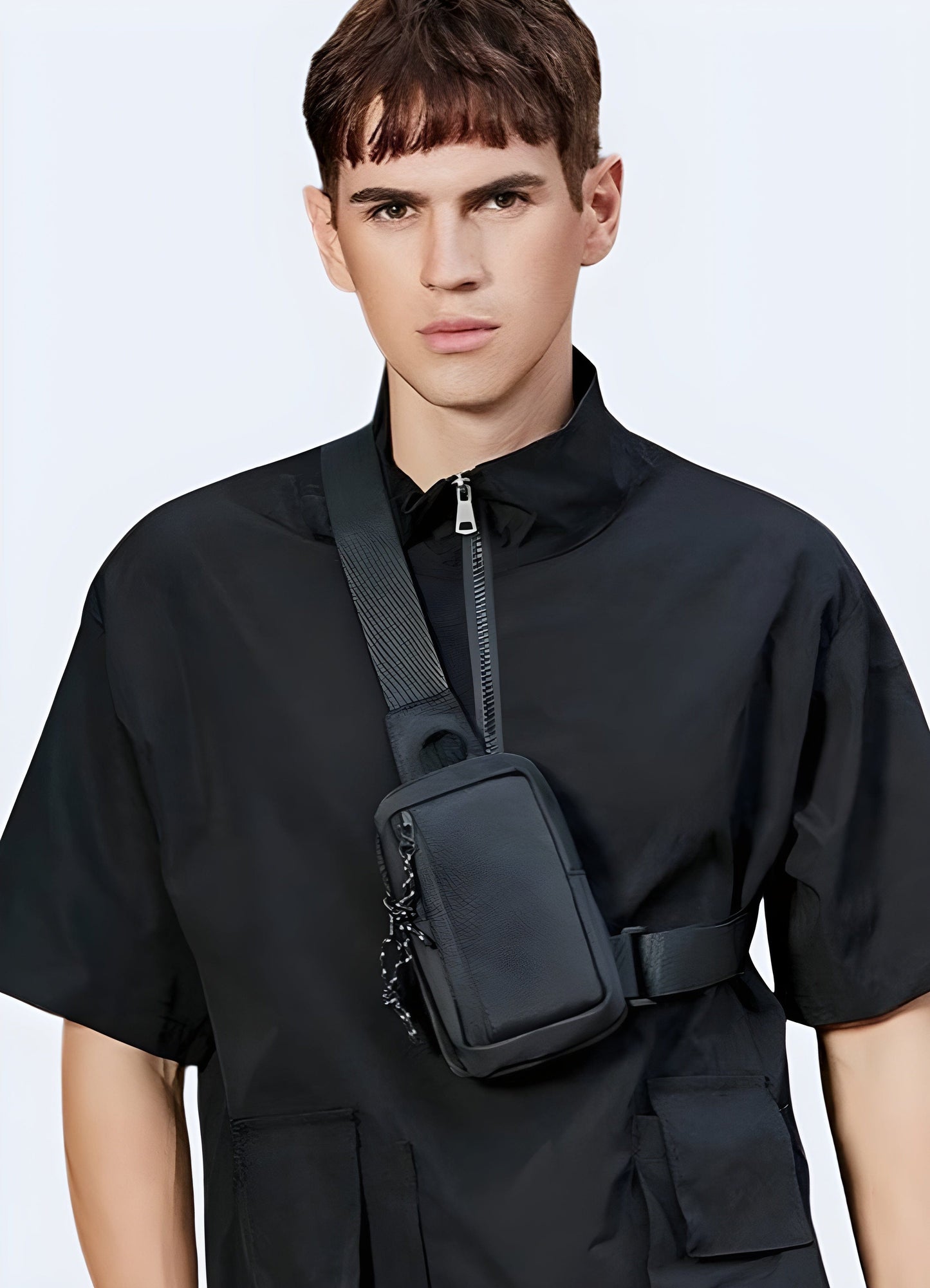 Men wearing cross chest sling bag, front view, UK. Modern and functional design.