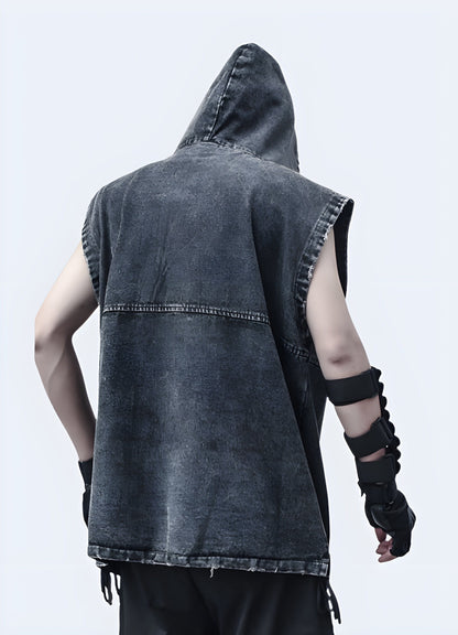 Model wearing a trendy denim vest with an attached drawstring hood, showcasing the garment's relaxed fit and stylish back view, perfect for a casual, street-ready look when layered over everyday outfits.