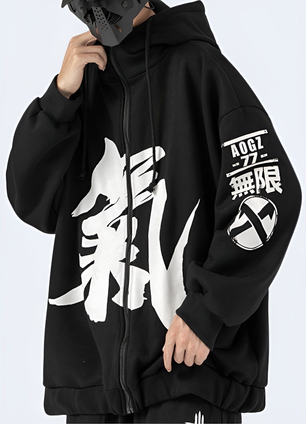 Man wearing a black hoodie with Japanese kanji print, left side view, available in the UK.