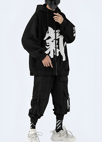 Man wearing a black hoodie with Japanese kanji print, right side view, available in the UK.