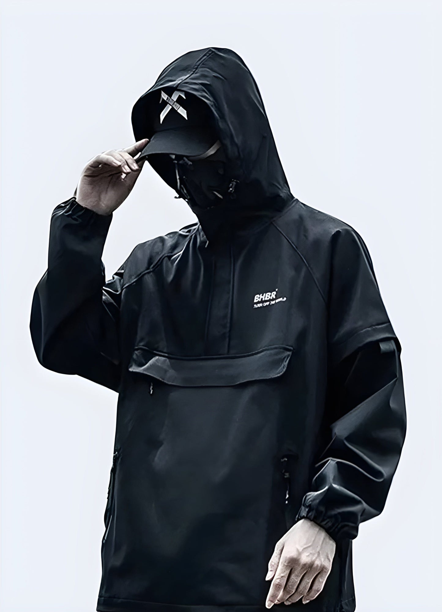 Side view of a man wearing a high-performance technical jacket, showcasing its sleek design and functionality.