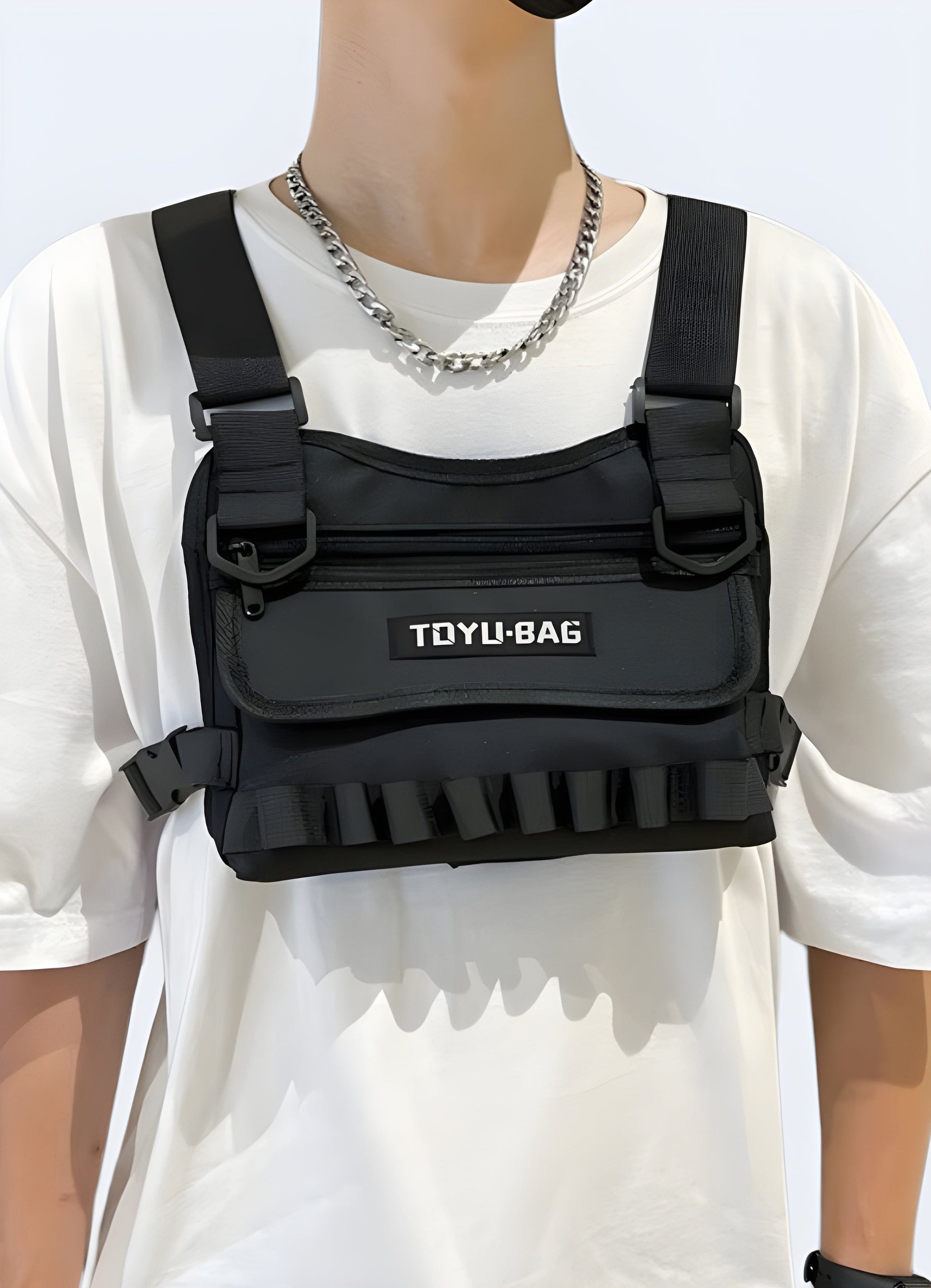 Man wearing TDYU black chest bag, front view, UK. Modern and functional design.