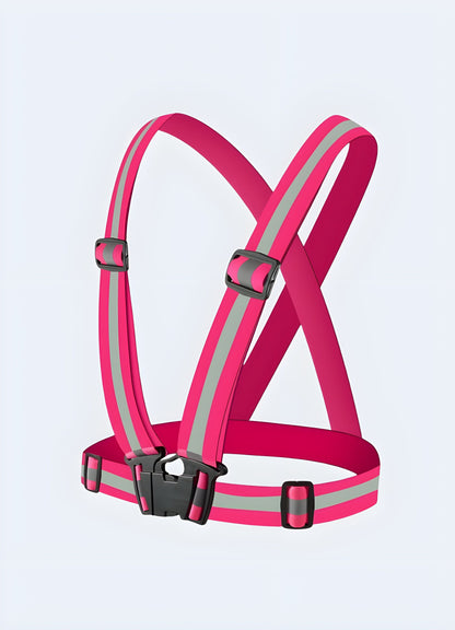 Rose red techwear harness with neon reflective stripes, offering high visibility and a bold aesthetic for wearers in the UK.