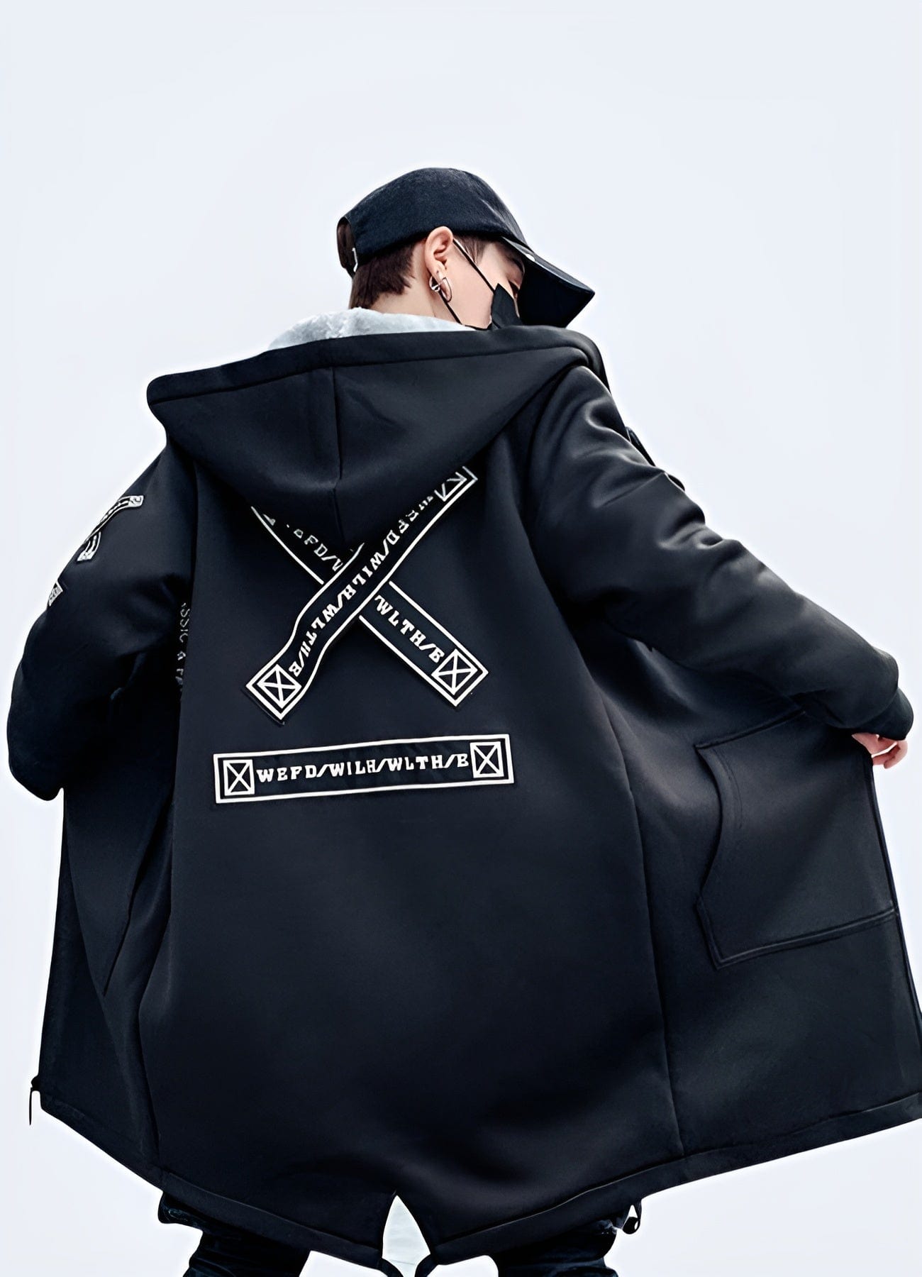 Back view of an oversized streetwear coat, highlighting its relaxed silhouette, innovative materials, and fashion-forward appeal, ideal for UK consumers looking to make a statement in the city streets.