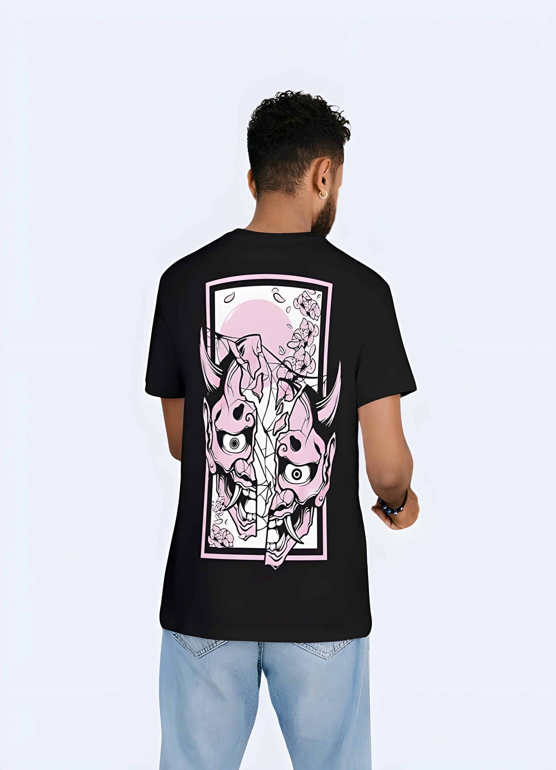 Front view of a pink t-shirt showcasing a fierce oni demon, adding a vibrant and unconventional twist to this traditional Japanese motif in the UK.