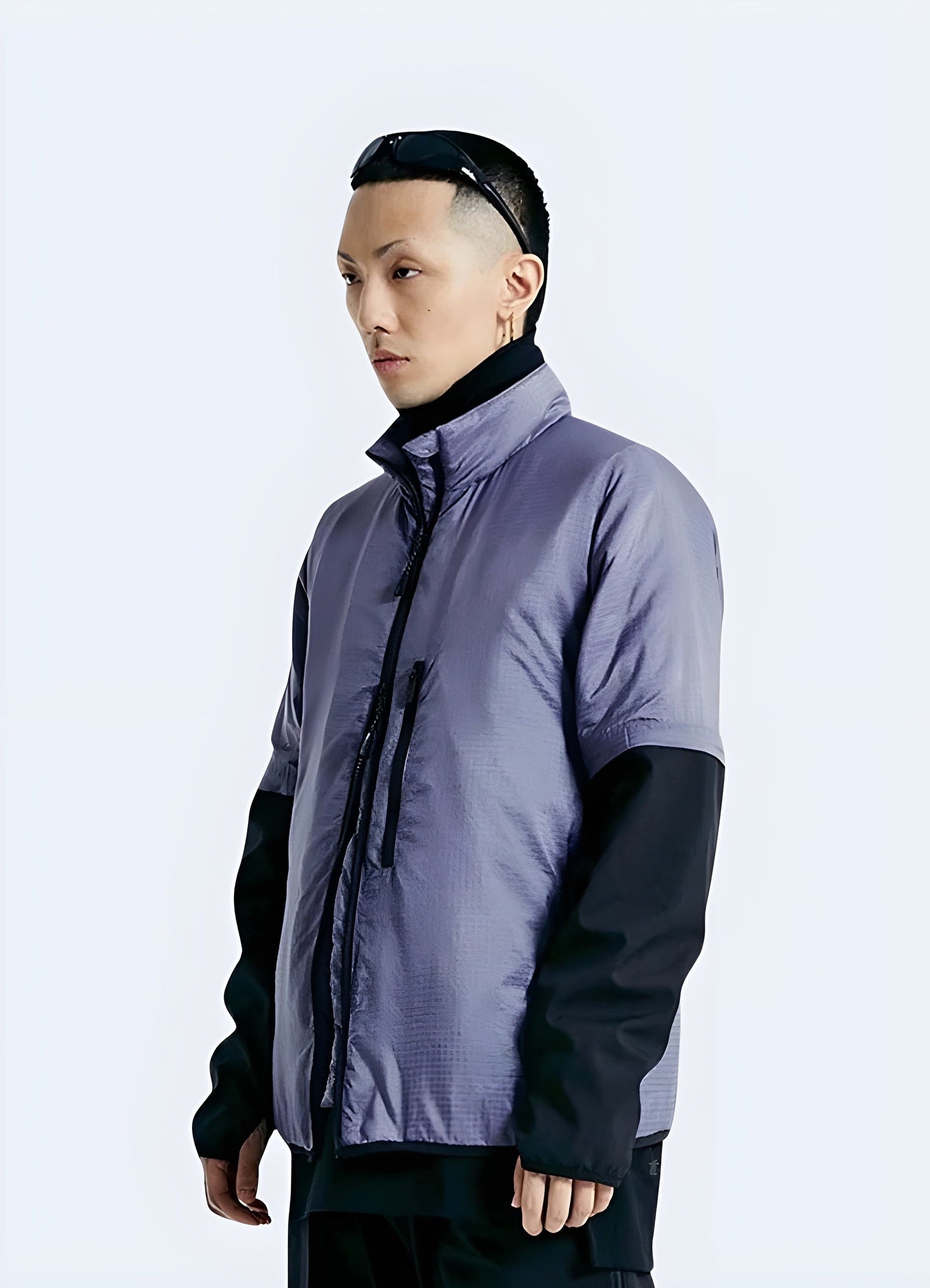 Cutting-edge purple techwear jacket featuring innovative materials and futuristic design, photographed in the UK.