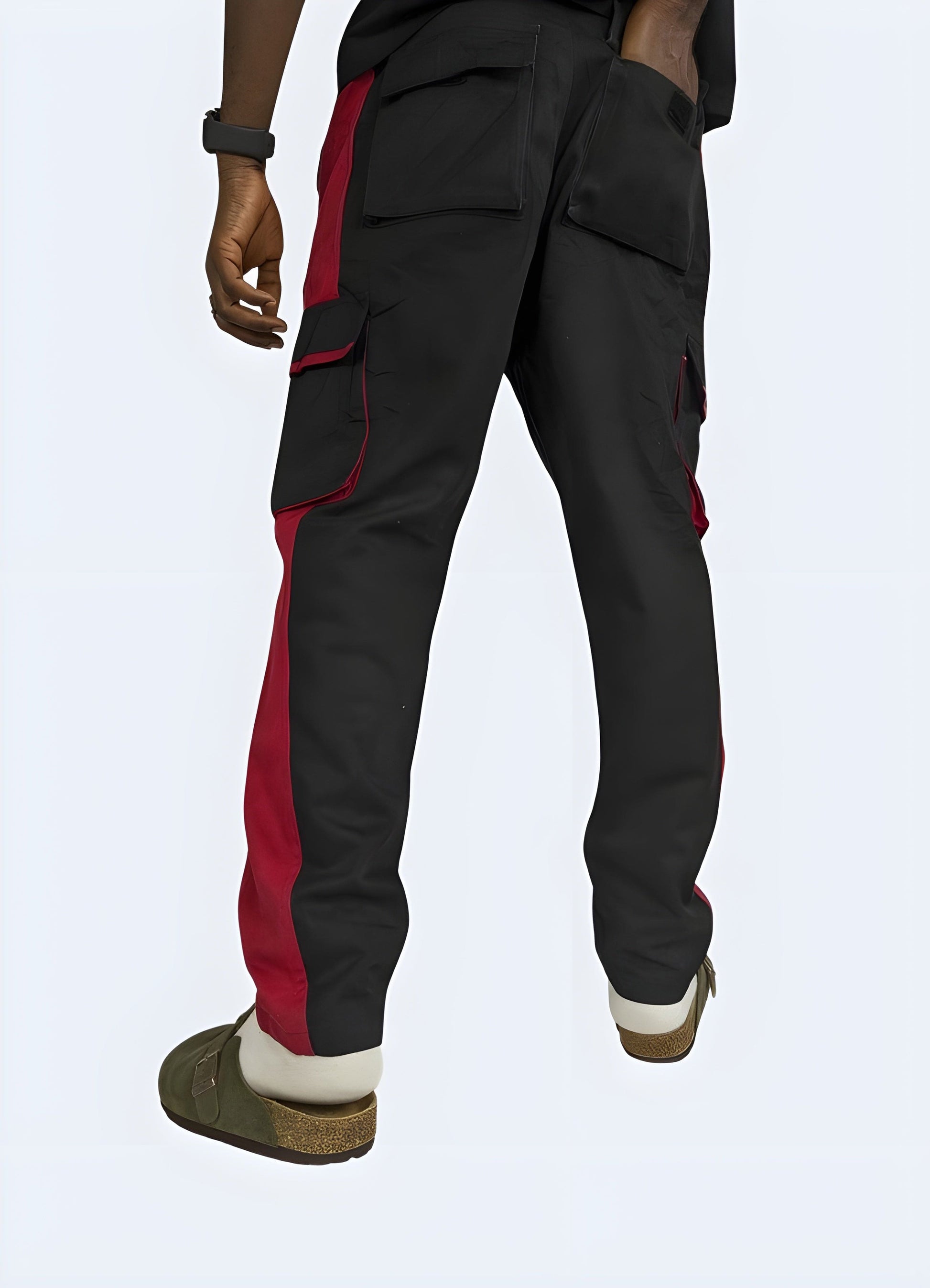 Red techwear pants, back view, trendy streetwear style, available in UK sizes.