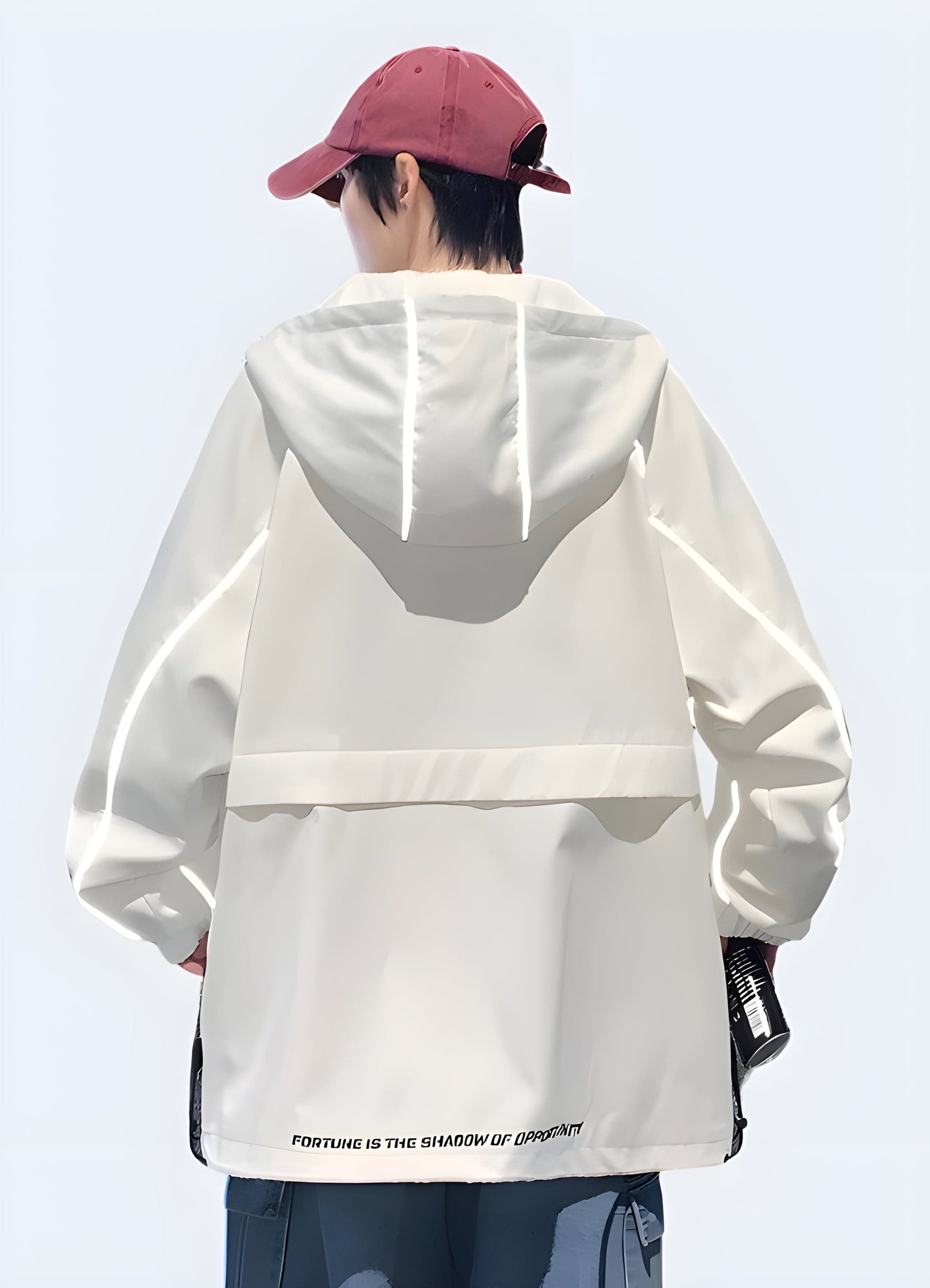 Back view of a reflective rain jacket outfit inspiration, demonstrating its versatility and practicality for various outdoor activities and everyday wear in the UK.