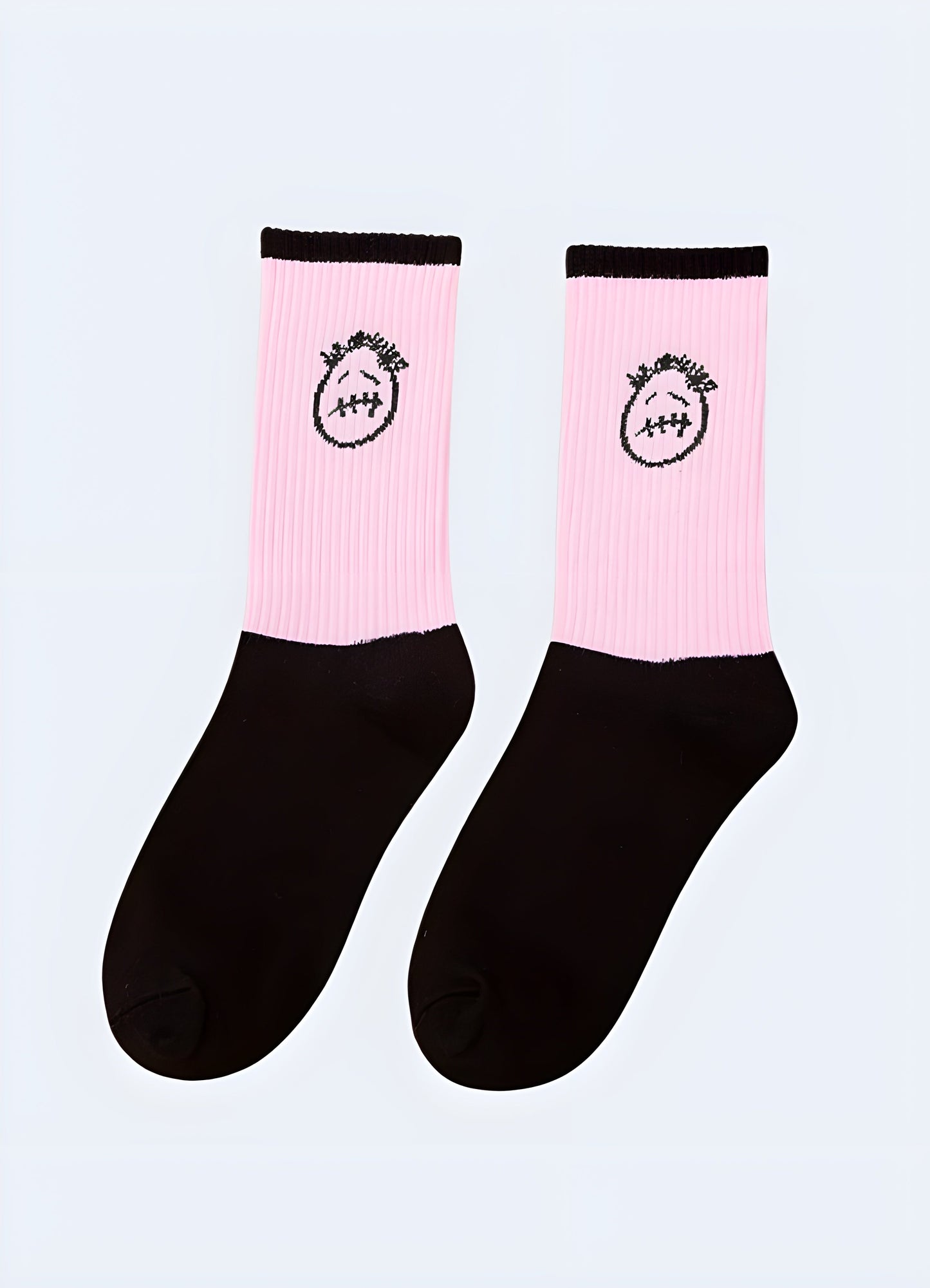 Pink sad face socks presented from the side view, offering a cute and whimsical addition to any outfit, perfect for UK individuals seeking a touch of humor in their style.