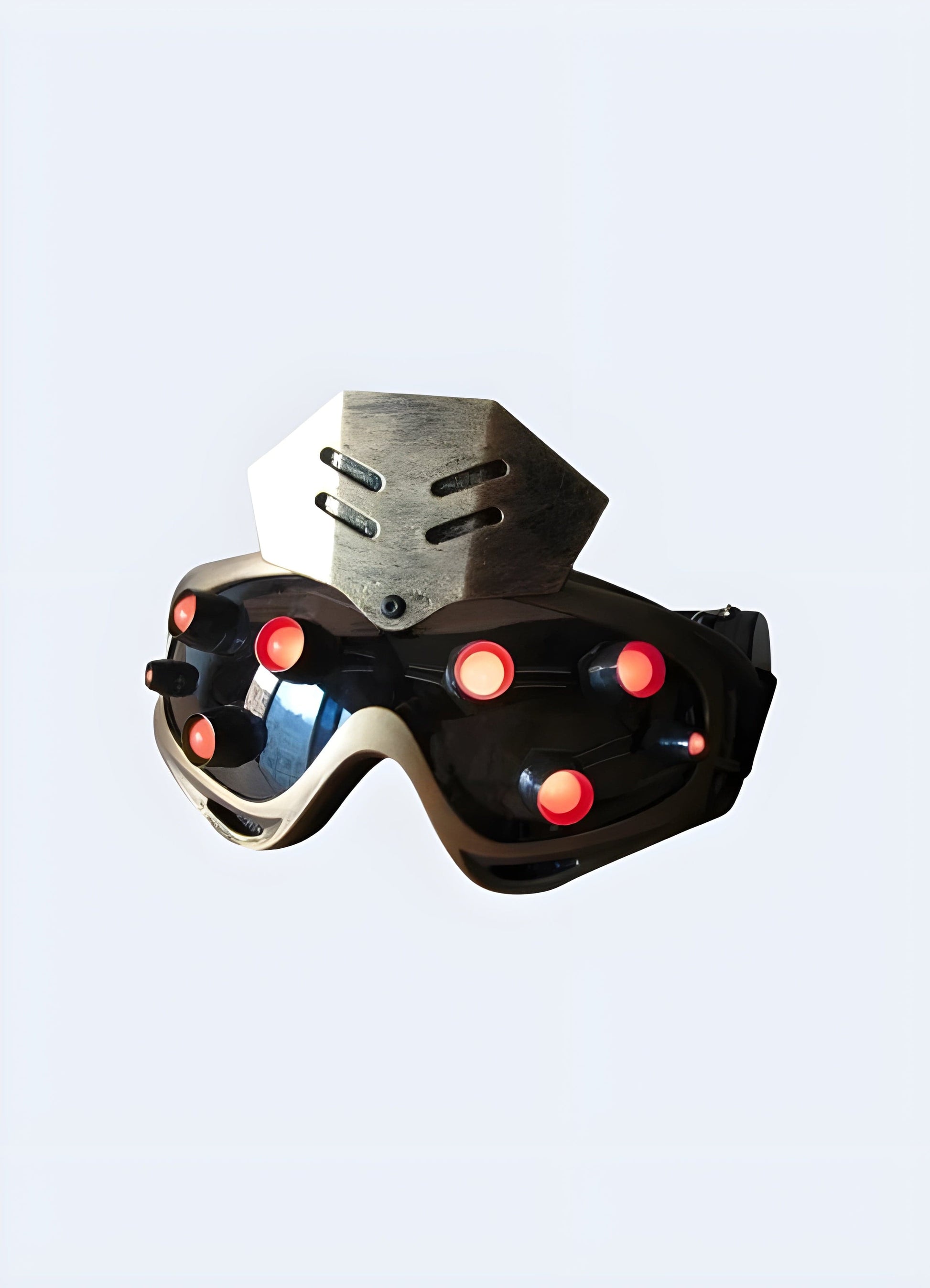 Front side view of a gold sci-fi cyberpunk mask with a red shield. Merges a high-tech aesthetic with striking hues.