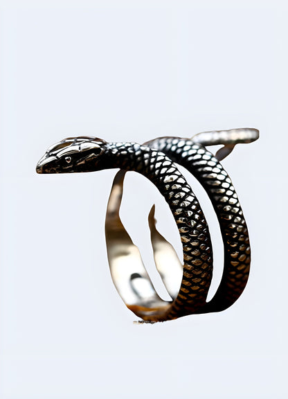 Silver snake ring in a side view worn by a model, UK, displaying its elegant and serpentine shape.