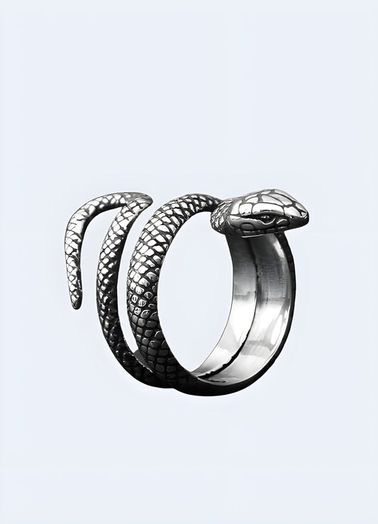 Silver snake ring with a coiled design, UK, featuring intricate detailing.