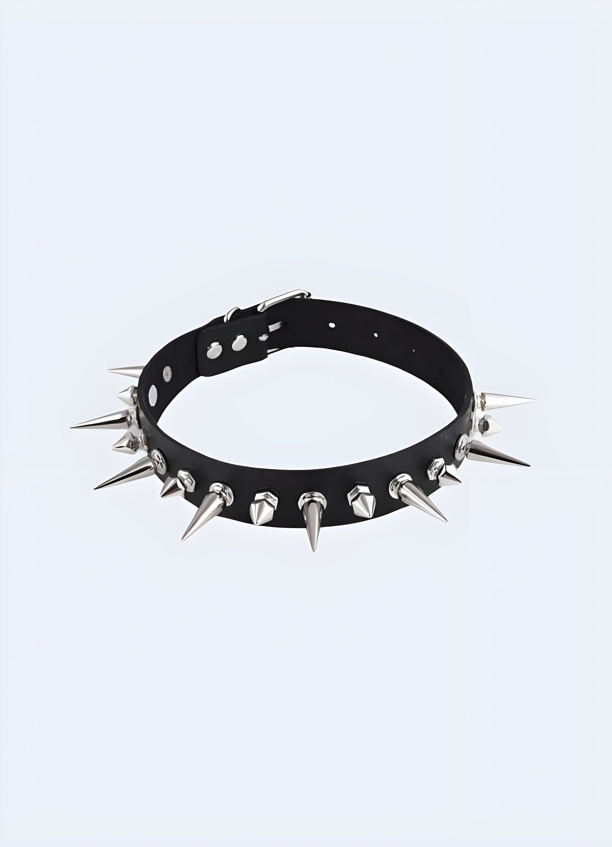 A bold spike choker necklace featuring sharp, evenly spaced spikes, set against a neutral background to highlight its edgy and daring design.