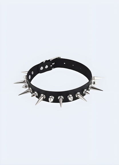 A bold spike choker necklace featuring sharp, evenly spaced spikes, set against a neutral background to highlight its edgy and daring design.