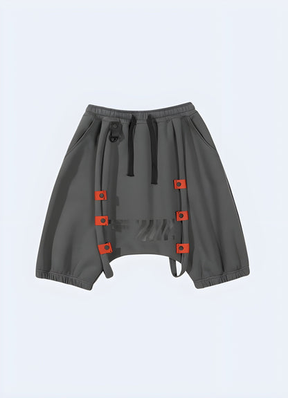 The elastic waistband and drawstrings ensure a perfect fit, as they smFront view of grey streetwear sweat shorts, featuring a classic color and modern cut, suitable for everyday wear in the UK.oothly encapsulate your waist. 