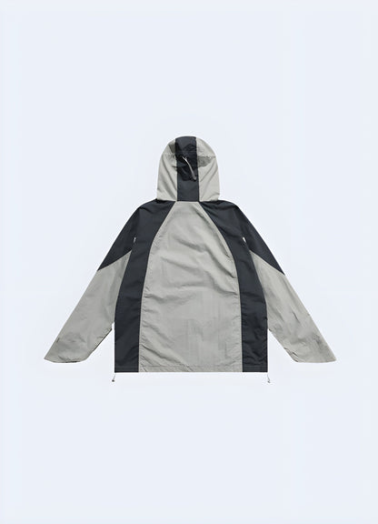 Back view of an urban ninja streetwear windbreaker, showcasing its streamlined silhouette, innovative construction, and fashion-forward appeal, ideal for UK consumers looking to make a statement in the city streets.