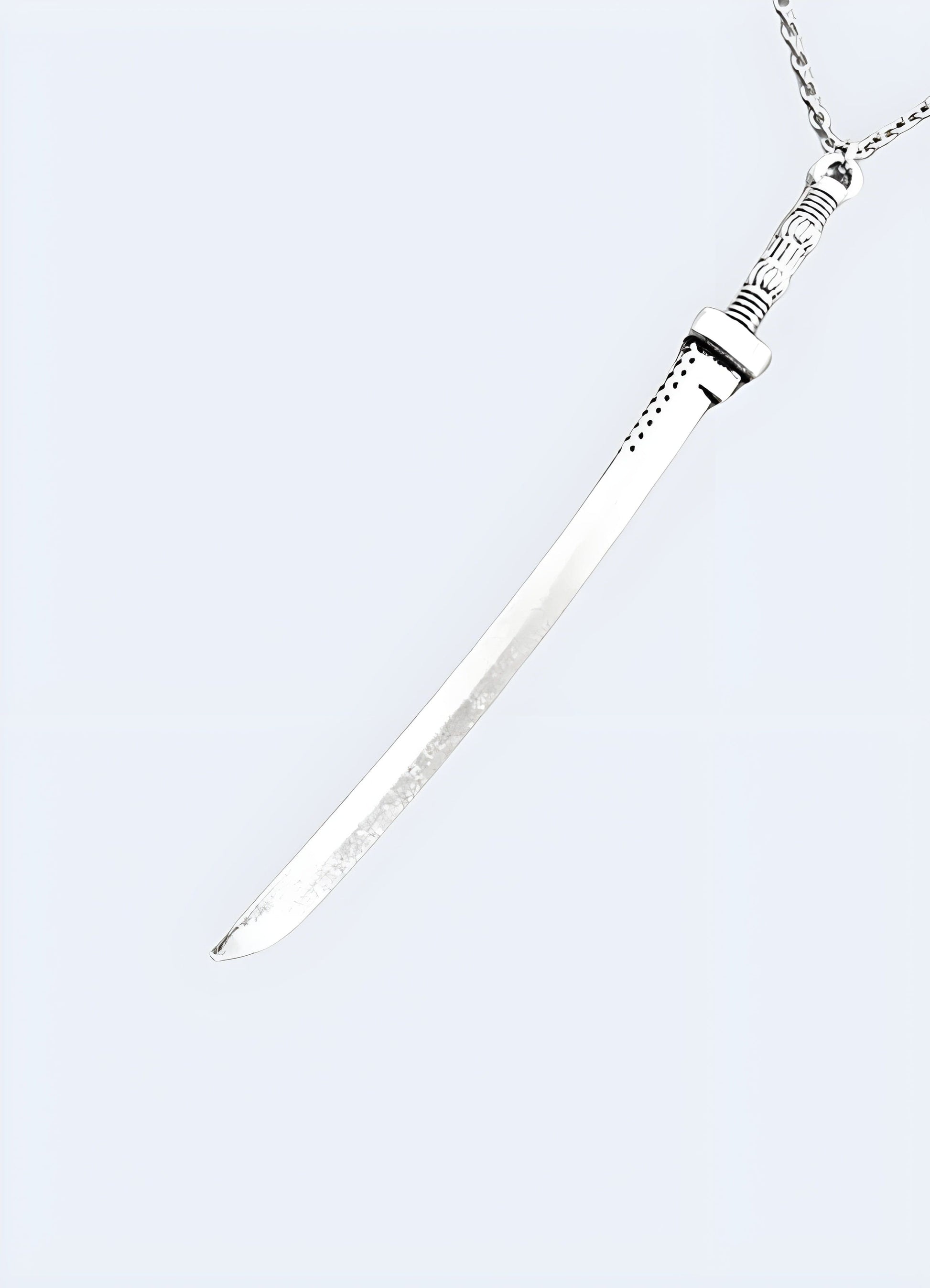 Sword necklace shown in a side view on a model, UK, highlighting its unique and elegant design.