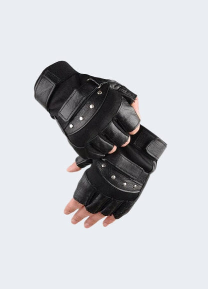 Model wearing black tactical fingerless leather gloves, front view, displaying a snug fit with adjustable wrist straps and sleek design.